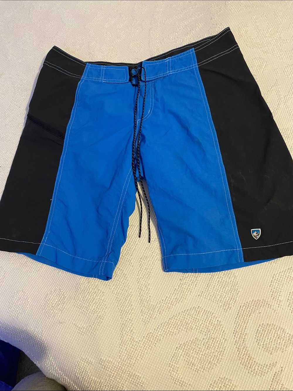 Kuhl Blue and Black Men's Swim Board Shorts, no rips or holes.